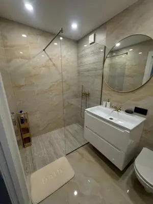 a bathroom with a toilet and a sink and a shower at The Hidden Gem Rukla in Rukla