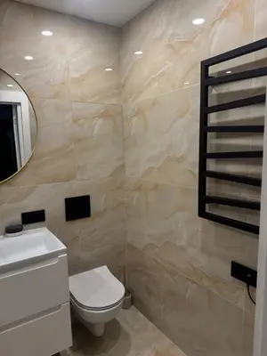 a bathroom with a toilet and a mirror at The Hidden Gem Rukla in Rukla