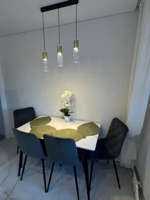 a dining room with a table and chairs at The Hidden Gem Rukla in Rukla