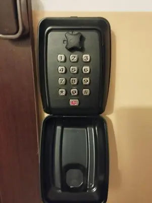a black remote control is attached to a door at Projektuotojų Apartamentai in Panevėžys