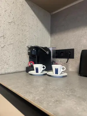 two coffee cups sitting on top of a counter at Marių namai in Kaunas