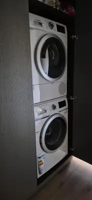 two washing machines stacked on top of each other at Cozy 3-Room Flat by Twinsbet Arena & Ozas in Vilnius