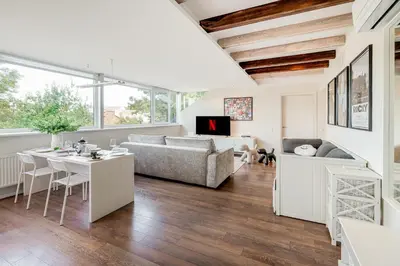 a living room with a couch and a table at HYPE Apartments in Kaunas