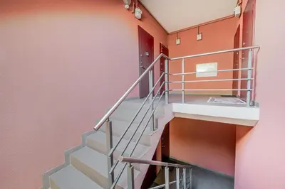 a staircase in a building with orange walls at HYPE Apartments in Kaunas