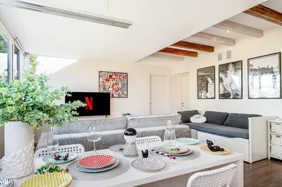 a living room with a table and a couch at HYPE Apartments in Kaunas