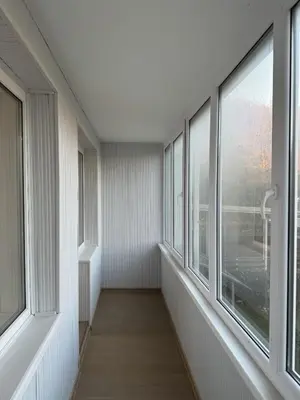 an empty hallway with windows in a building at Cozy Apartment Near Forest in Kaunas