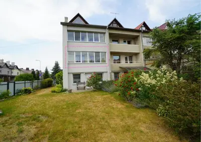 a large house with a yard in front of it at Cozy Apartment Near Forest in Kaunas
