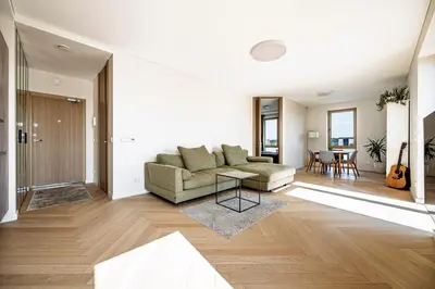 a living room with a couch and a table at Modern city center apartment in Vilnius