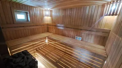 an inside view of a wooden sauna at Ūdros slėnis in Bildžiai