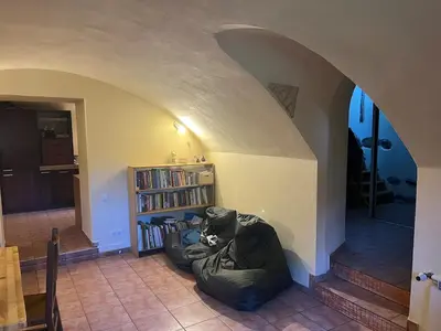 a cat sitting in a bean bag chair in a room at The cave in Vilnius