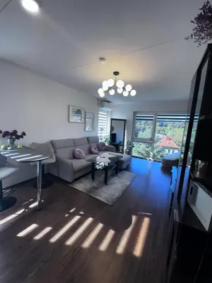 a living room with a couch and a table at Condo in Kaunas