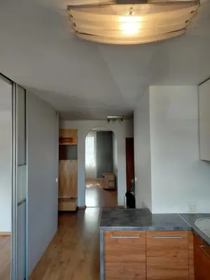 a kitchen with a counter top and a ceiling at Two-Bedroom Flat Close to Downtown in Kaunas