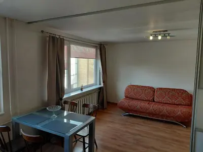 a living room with a couch and a table at Two-Bedroom Flat Close to Downtown in Kaunas