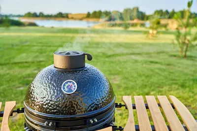 a blue pot sitting on top of a wooden bench at Oriana Resort