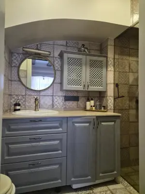a bathroom with a sink and a mirror at Užupio Sparnai in Vilnius