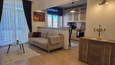 a living room with a couch and a table at Vytauto Apartments in Šiauliai