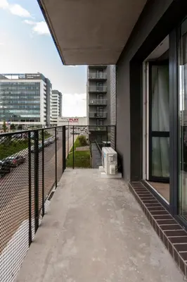 a balcony with a view of a building at Modern 2 BDR Apartment next to Vilnius Outlet by URBAN RENT in Vilnius
