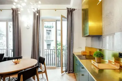 a kitchen with a table and a dining room at Superior 2 Bedroom 2 Bathroom Apartment by Reside Baltic in Vilnius
