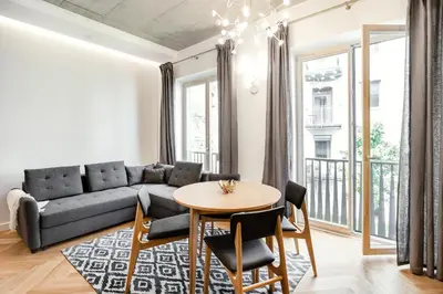 a living room with a couch and a table at Superior 2 Bedroom 2 Bathroom Apartment by Reside Baltic in Vilnius
