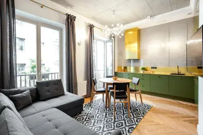 a living room with a couch and a table at Superior 2 Bedroom 2 Bathroom Apartment by Reside Baltic in Vilnius