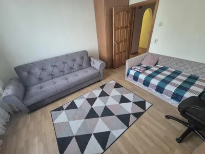 a living room with a couch and a rug at Entrara in VNO