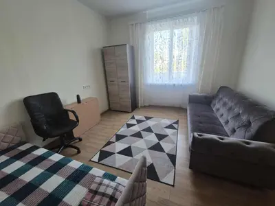 a living room with a couch and a chair at Entrara in VNO