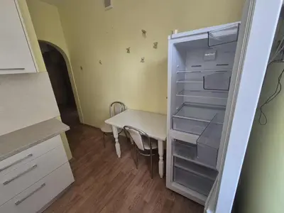 an empty refrigerator with a table in it at Entrara in VNO