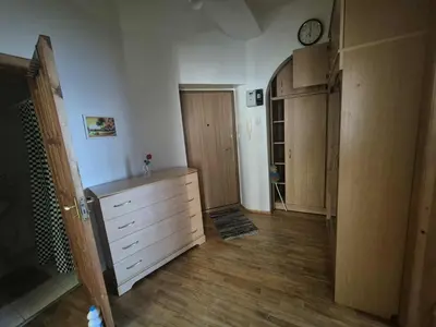 a room with a dresser and wooden cabinets in a room at Entrara in VNO