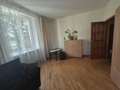 a living room with a couch and a dresser and a window at Entrara in VNO