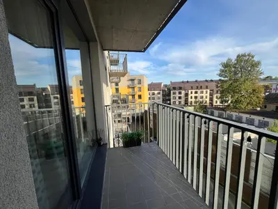 a balcony with a view of a city at M27 Apartments in Vilnius