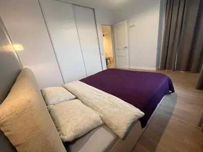 a small room with a bed and a couch at M27 Apartments in Vilnius