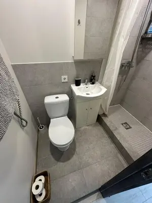 a bathroom with a toilet and a sink at Little cocoon at border of old city in Vilnius