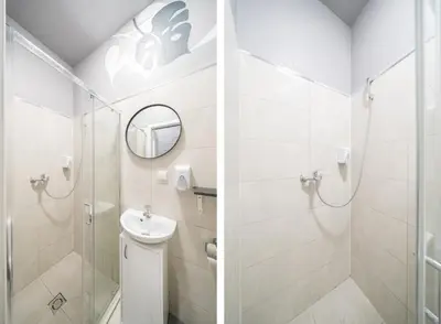 a bathroom with a sink and a shower at Sodų 17 Self Check-in - Lollo Stay in Vilnius