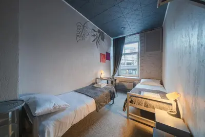 a bedroom with two beds and a window at Sodų 17 Self Check-in - Lollo Stay in Vilnius