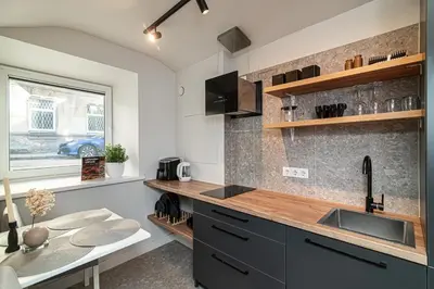 a kitchen with a sink and a counter top at Cozy flat in Vilnius Old Town in Vilnius