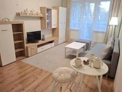 a living room with a couch and a table at Angel Apartment near city centre in Vilnius