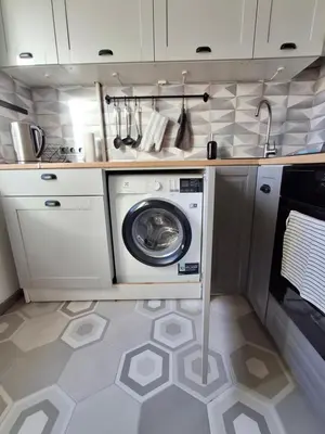 a kitchen with a washing machine in a kitchen at Angel Apartment near city centre in Vilnius