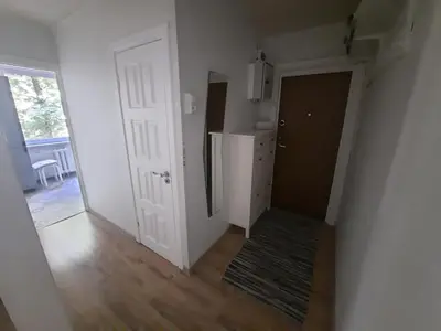 an empty room with a door and a hallway at Angel Apartment near city centre in Vilnius