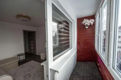 a hallway of a house with a window at Feliz Stay in Šiauliai
