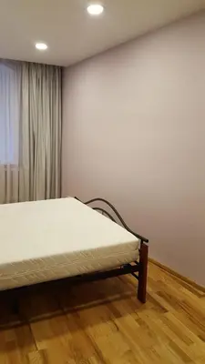 a bedroom with a bed in a room at 2 bedroom old town apartment with parking in Vilnius