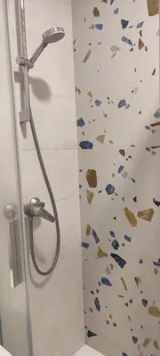 a shower with a shower head in a bathroom at QuickStopVilnius in Vilnius