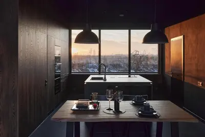 a kitchen with a table with glasses and a sink at The Barn
