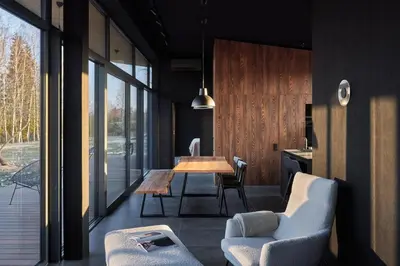 a dining room with a wooden table and chairs at The Barn