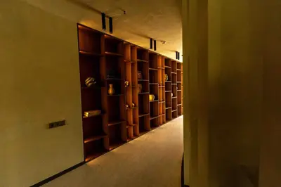 a long hallway with wooden shelves in a room at Sky Pool Escape Luxury Apartment in Druskininkai Center in Druskininkai
