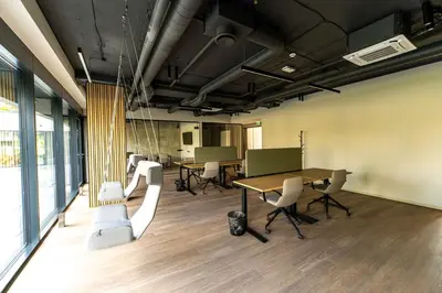 an office with a conference room with tables and chairs at Sky Pool Escape Luxury Apartment in Druskininkai Center in Druskininkai