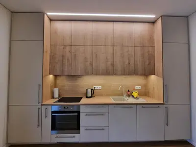 a kitchen with white cabinets and a sink at Vandens takas in Birštonas