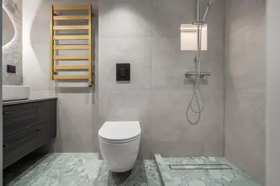 a bathroom with a white toilet and a sink at Golden loft in City centre Self check-in No 38 in Vilnius