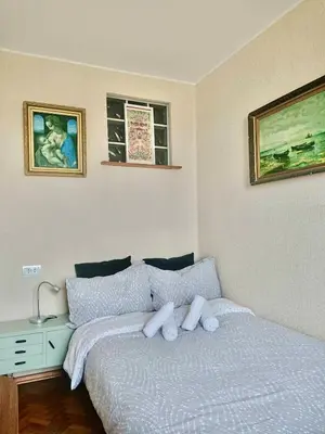 a bedroom with a bed with two white pillows at Cozy Apartment in Kaunas with Free Parking. in Kaunas
