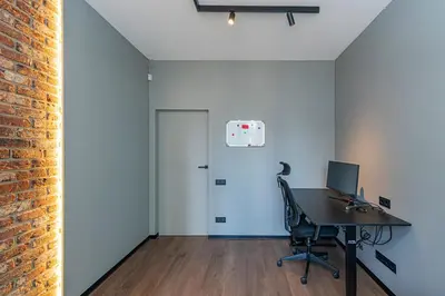an office with a desk with a computer and a door at Design 2 BD Apartment with Hot Tube by Domvia in Kaunas
