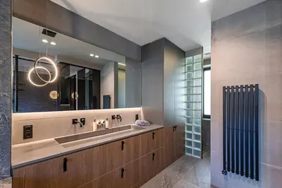 a bathroom with a sink and a mirror at Design 2 BD Apartment with Hot Tube by Domvia in Kaunas